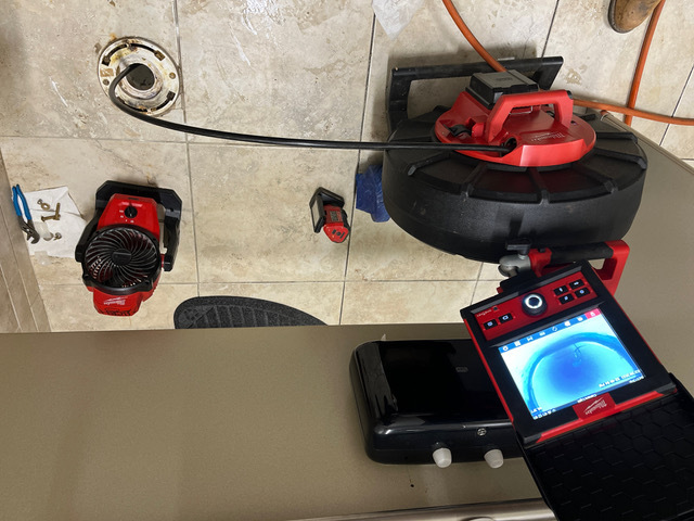 Milwaukee sewer camera reel and color monitor used by BF Plumbing for pipe inspections