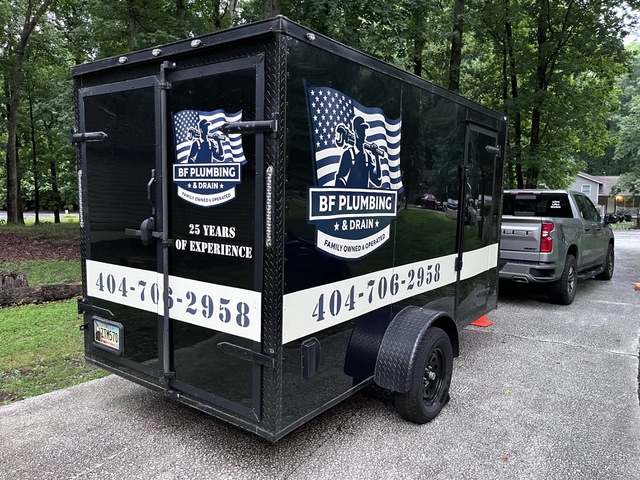 BF Plumbing & Drain enclosed service trailer staged on a driveway in Milton, GA — 25 years of experience, family owned and operated